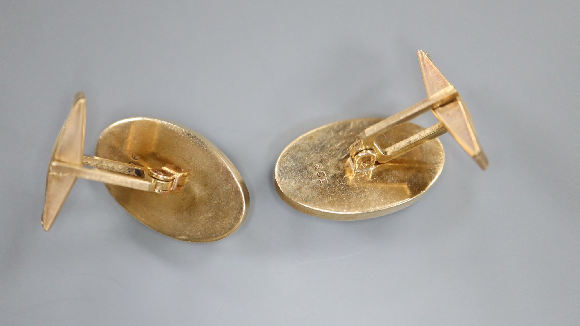 A pair of 9ct gold and opal doublet? set oval cufflinks, 24mm, gross 12.6 grams.